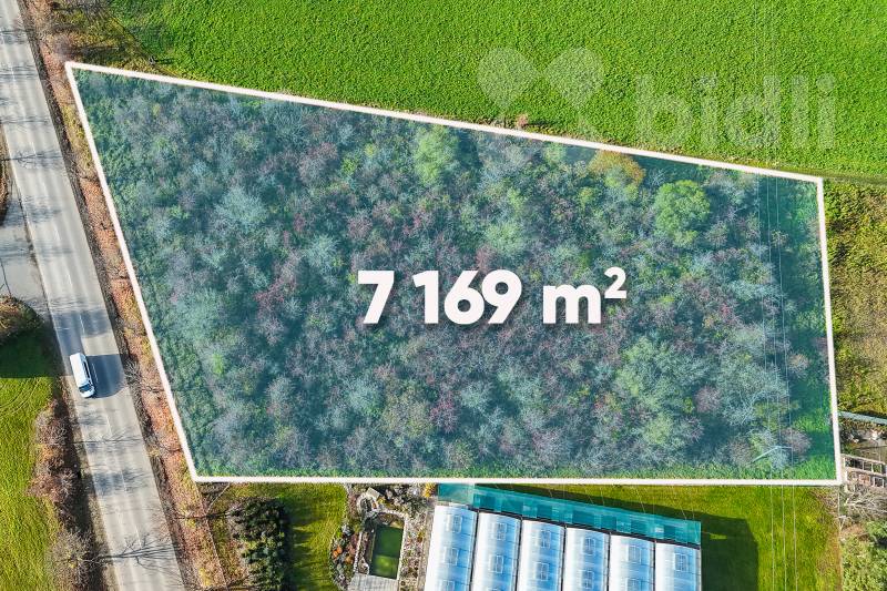 Prodej pozemku 7 169 m&#178; Postřižín