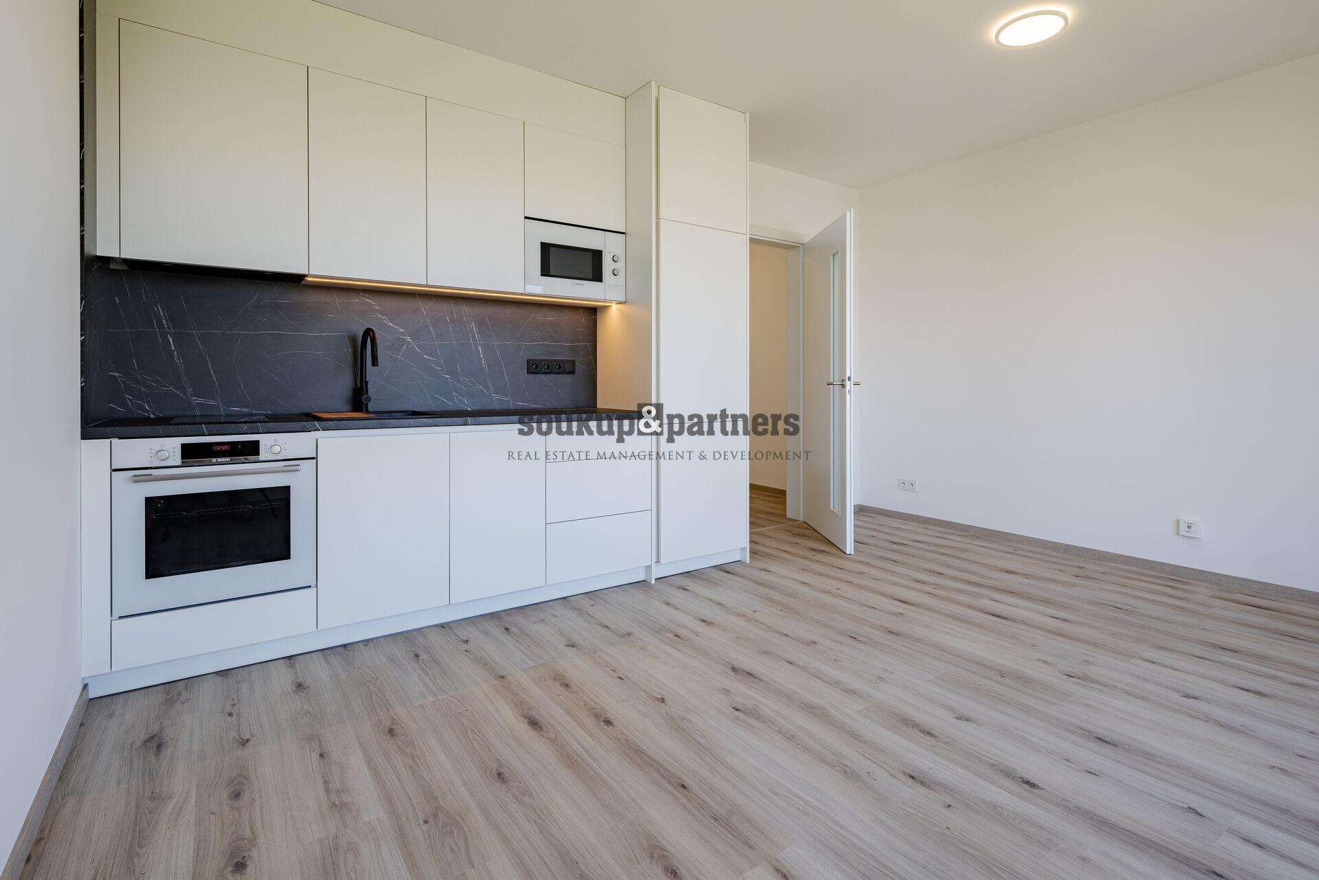Prodej bytu 1+kk 28 m² s garážovým stáním a sklepem v ceně – novostavba, Praha 9 – Letňany.