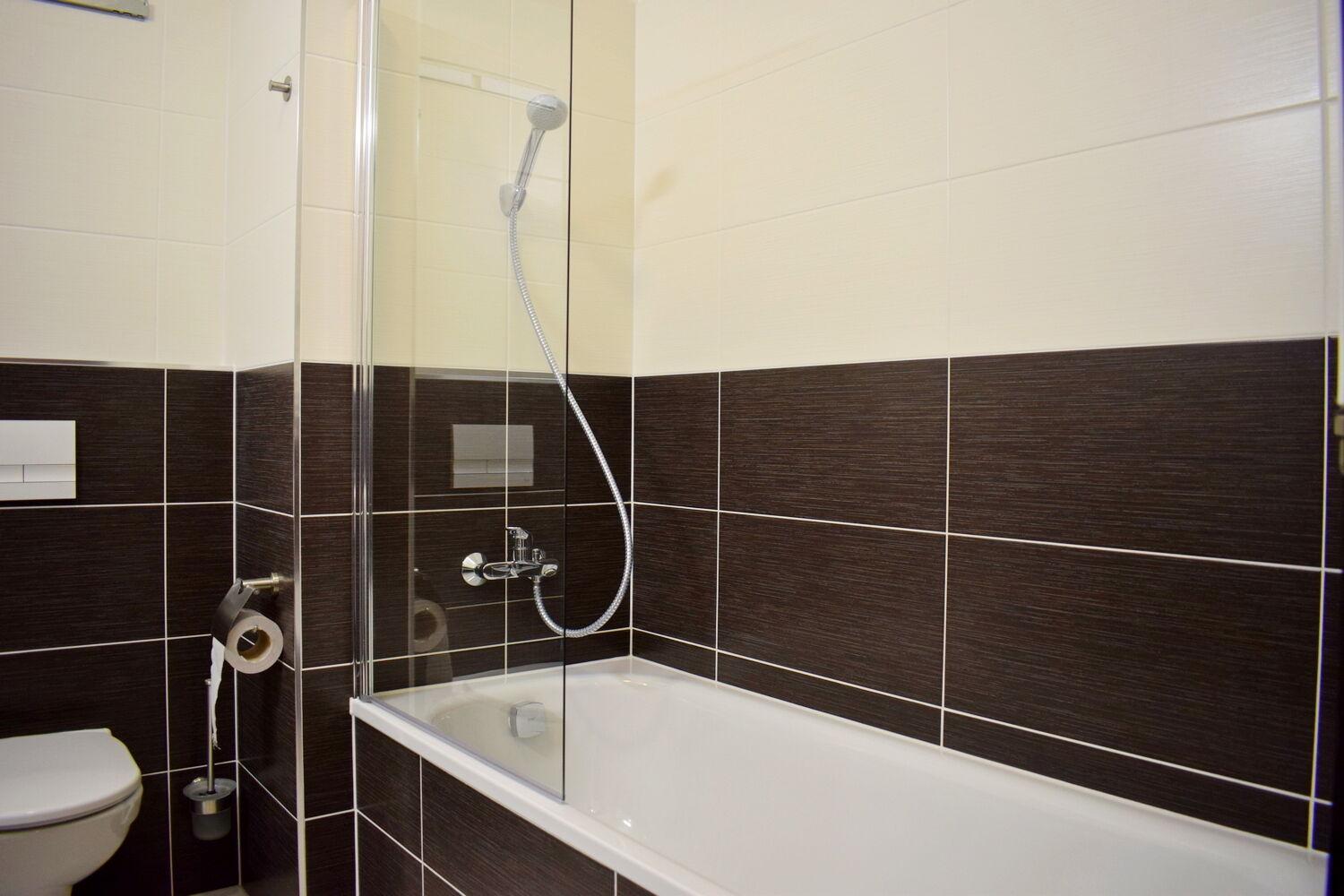 Moderní 2+kk s balkonem 60 m2 a gar. stáním v novostavbě, Praha 10