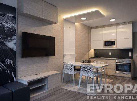 Moderní kuchyň s vestavěnými spotřebiči, světlým dřevěným obkladem a laminátovou podlahou, spojená s jídelním koutem s moderními židlemi. | Prodej bytu, 2+kk, 56 m²