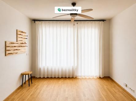 1778789564-a-wide-frontal-shot-of-a-minimal-empty-room-inte | Prodej bytu, 1+kk, 34 m²